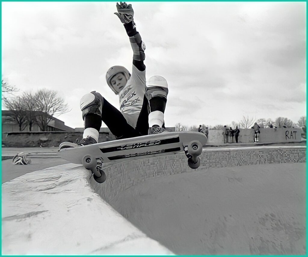 A young Steve Douglas, grinding pool coping on skateboard