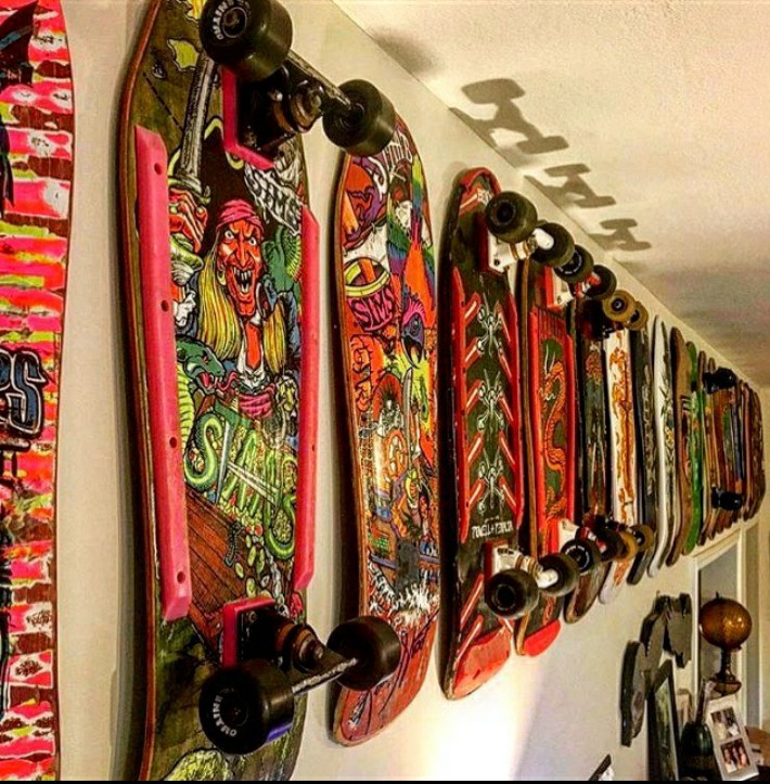 A wall of Johnny's Skateboard collection